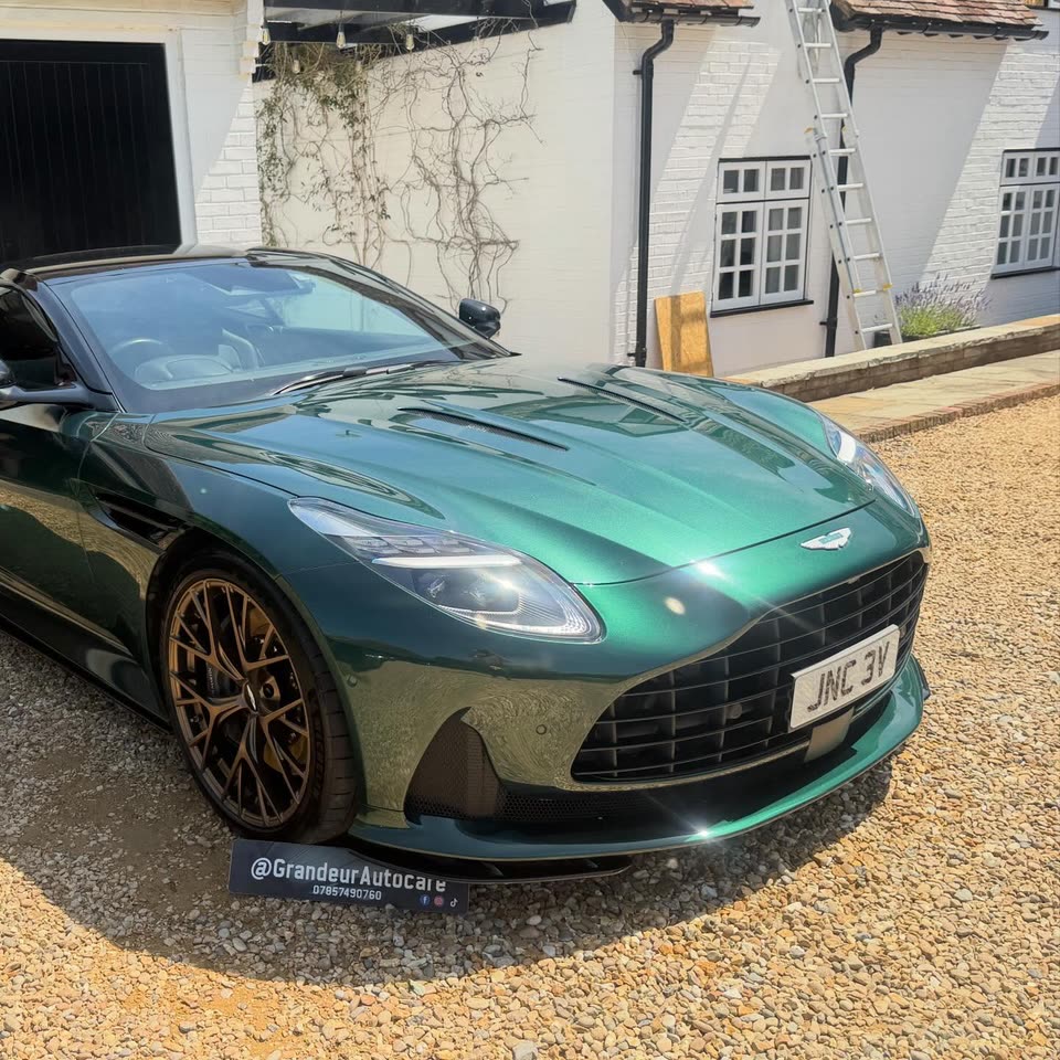 Green Aston Martin DBS with bronze wheels after a ceramic coating