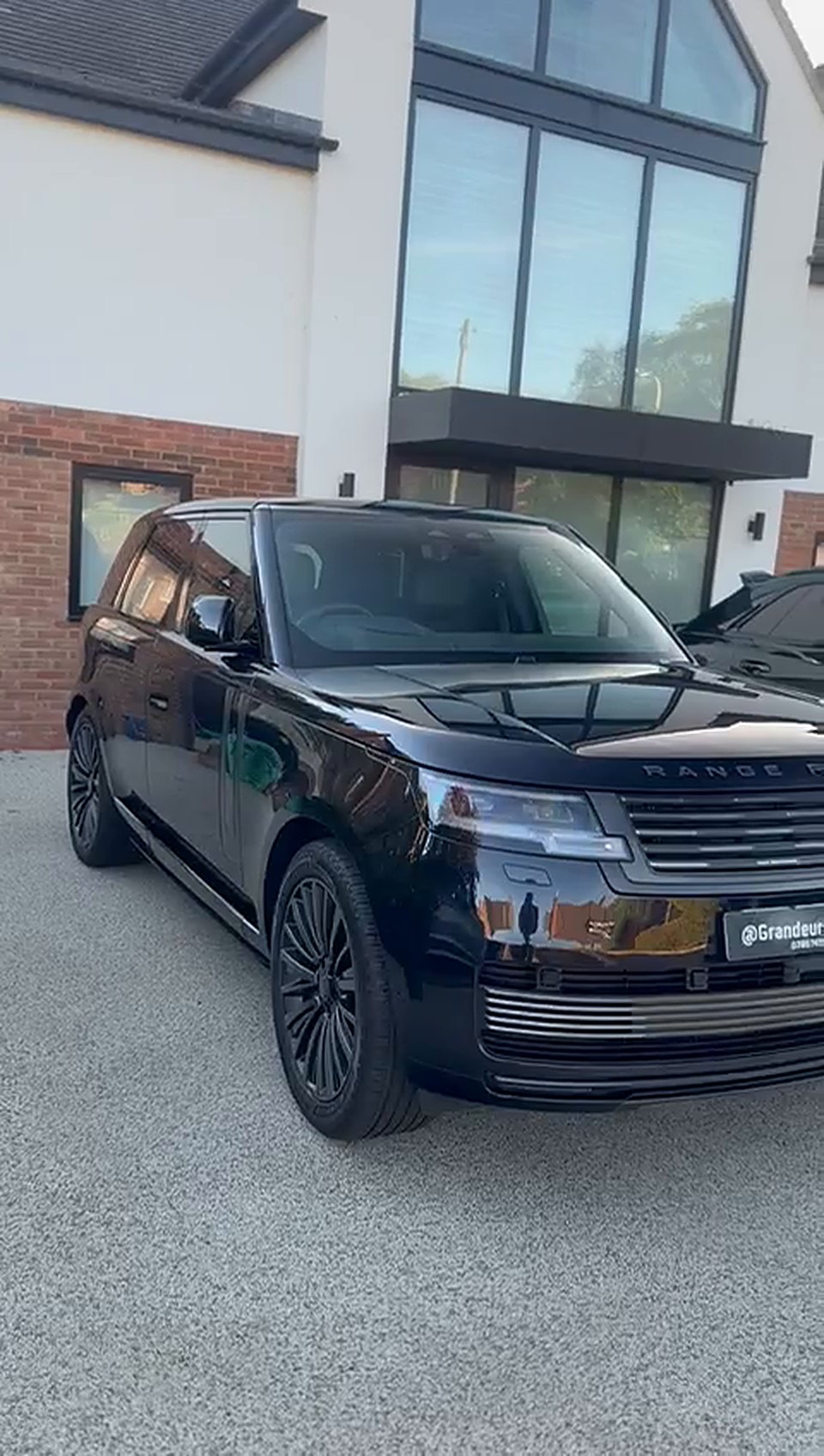 Black Range Rover on a driveway after a full detail